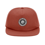 Red terracotta unstructured organic cotton cap with a golf logo 