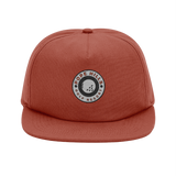 Red terracotta unstructured organic cotton cap with a golf logo 